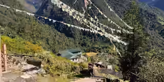 Colorful flags flutter above Annapurna foothills Colorful flags flutter above Annapurna foothills