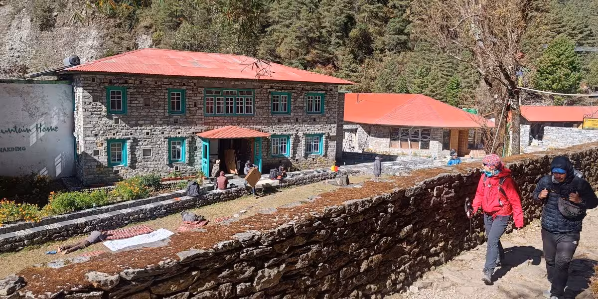 Mountain Lodge with resting trekkers