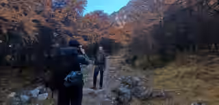 Trekkers joyfully taking photos in Nepal