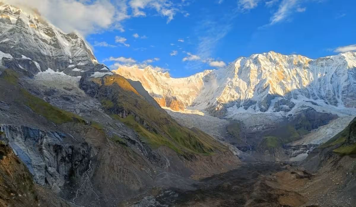 Lush green hills with Annapurna mountain backdrop