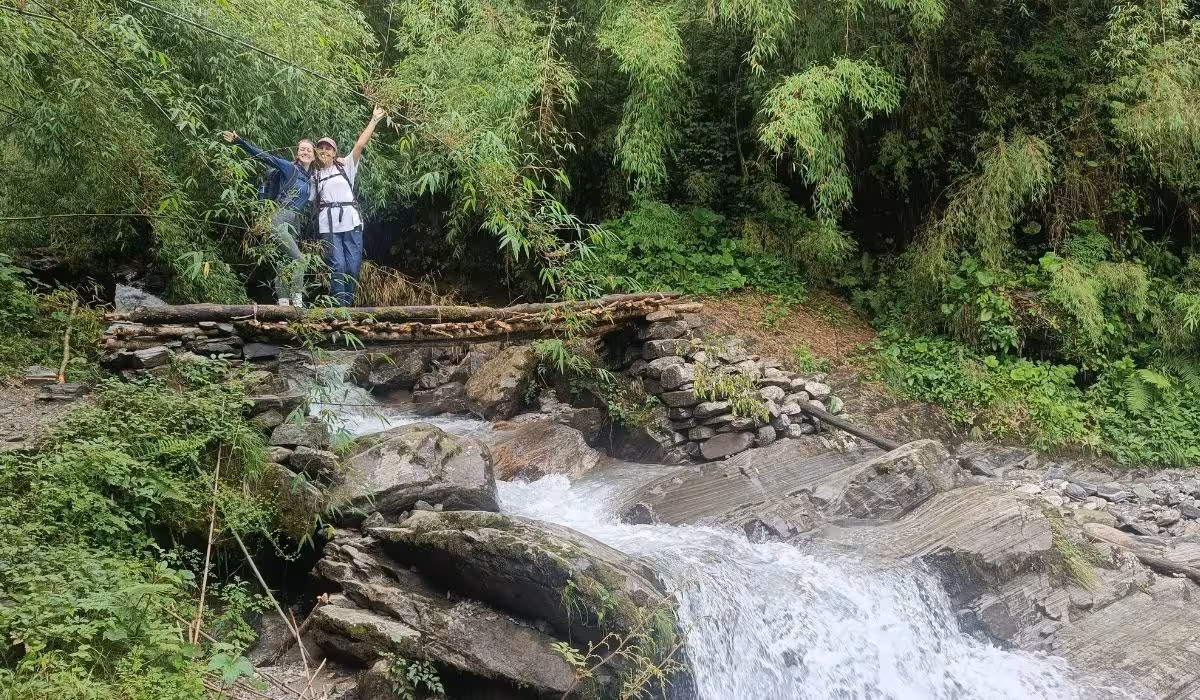 friends travelling happily towards annapurna range