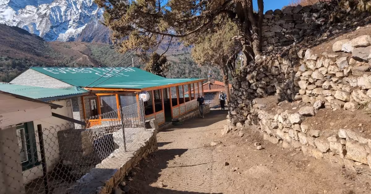 Walkers pass a lodge on the EBC journey on fall
