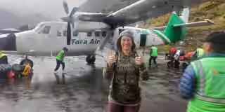 Travelers-boarding-Tara-Air-plane-in-rain