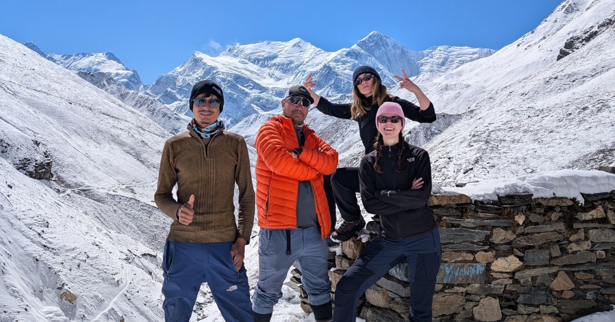 Trekkers walking across high altitude Annapurna Circuit